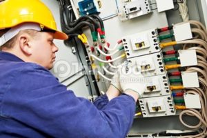 Electrician working on a circuit board